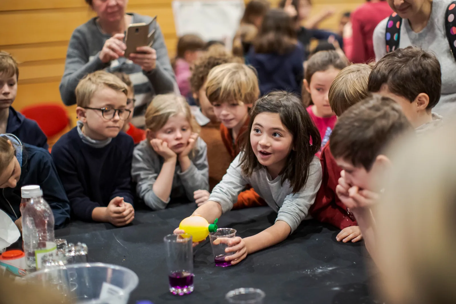 Children taking part in a hands-on science experiment.